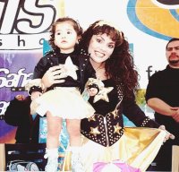 [With a young fan]