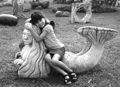 [Cassandra on mermaid sculpture]